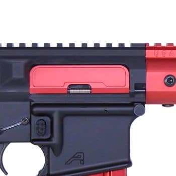 a close up of a red and black gun