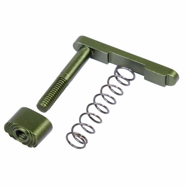 a green screw and spring on a white background