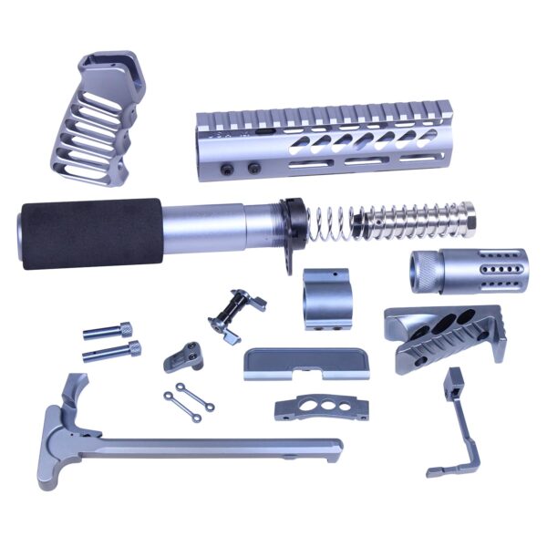 an assortment of tools and parts for a gun