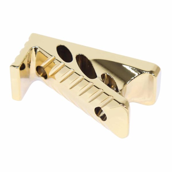 a gold metal object with holes in it