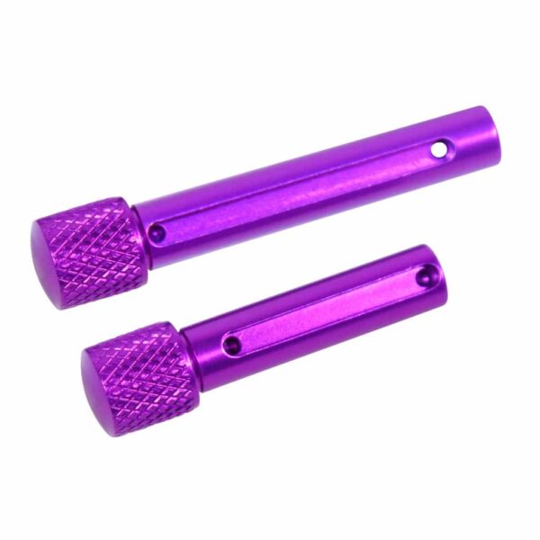 a pair of purple plastic grips with a white background