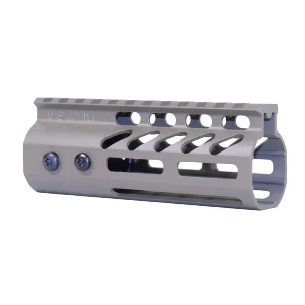 an aluminum muzzle for a rifle on a white background