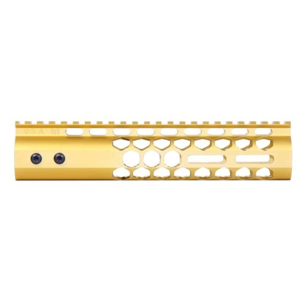 a gold plated rifle handle with holes