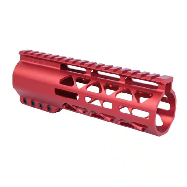 a red aluminum muzzle for a rifle on a white background