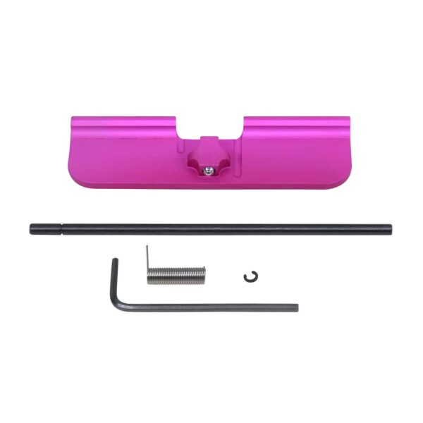 a pink plastic object with a metal handle
