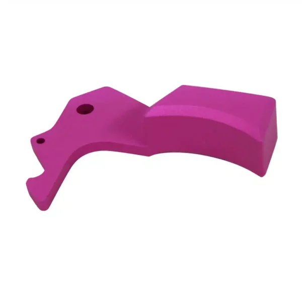 a pink plastic object on a white background