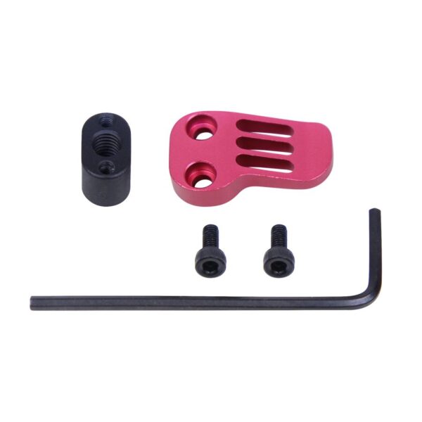 a pink plastic handle and screws for a camera