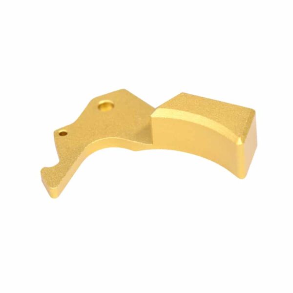 a gold metal object on a white background