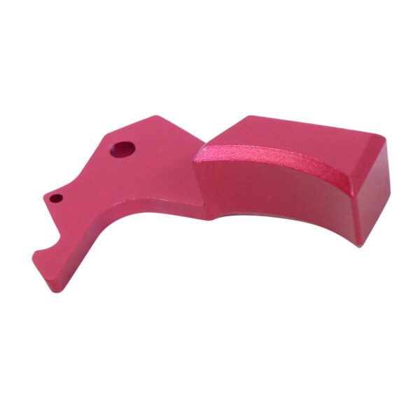 a pink plastic object on a white background