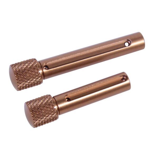 a pair of copper colored metal grips