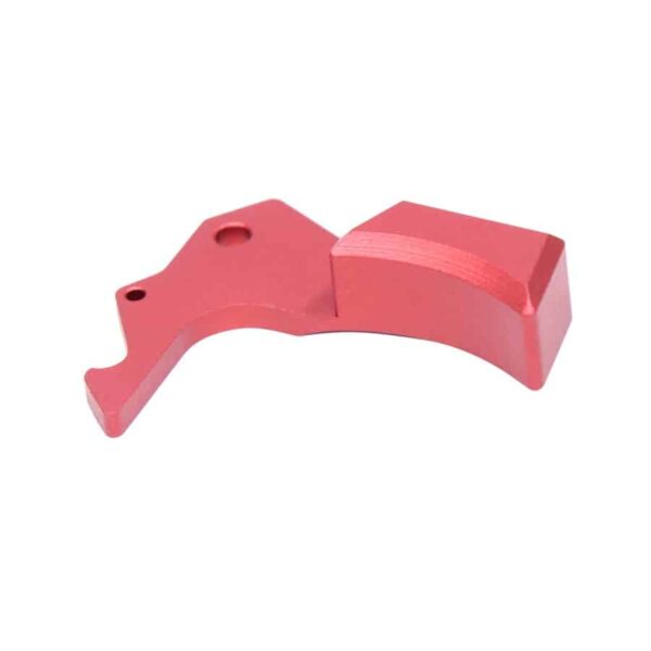 a pink plastic object on a white background