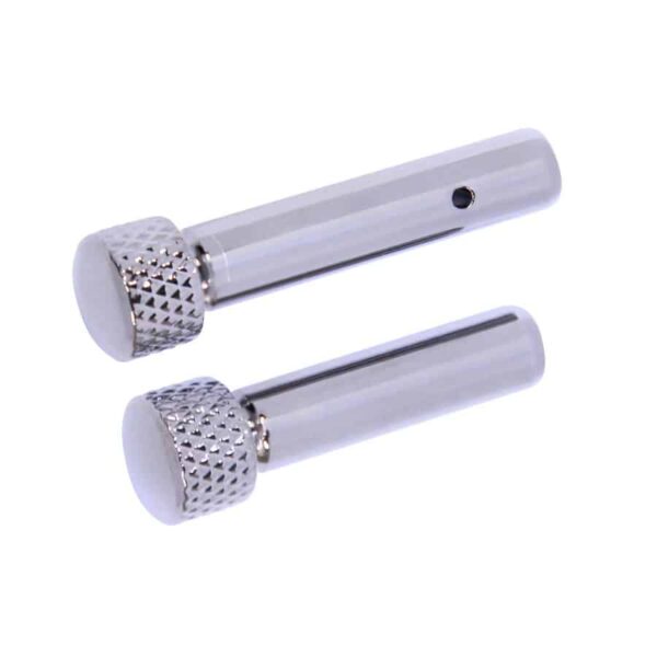 a pair of silver metal grips with a white background