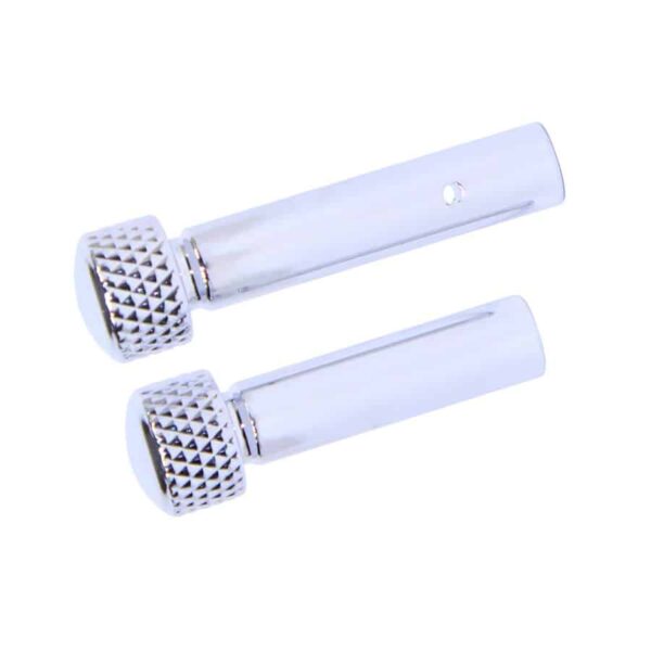 a pair of white metal grips with a white background